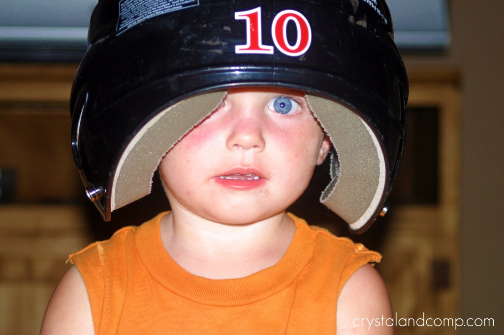 boy wearing baseball helmet