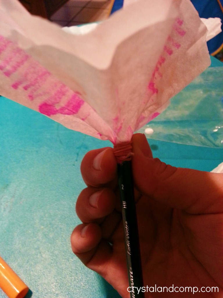 use a pencil and coffee filter to make paper flowers