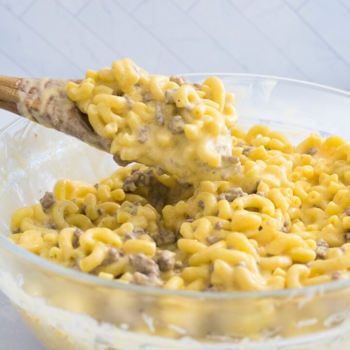 beef mac and cheese in bowl with spoon