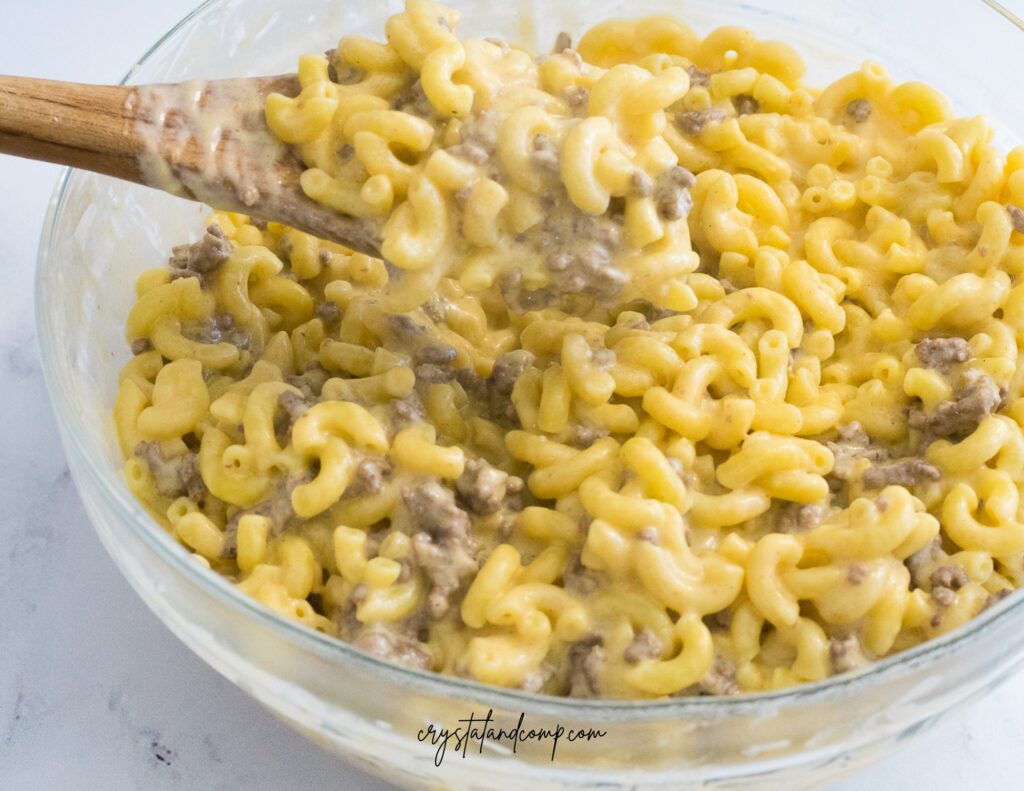 beef mac and cheese with wooden spoon