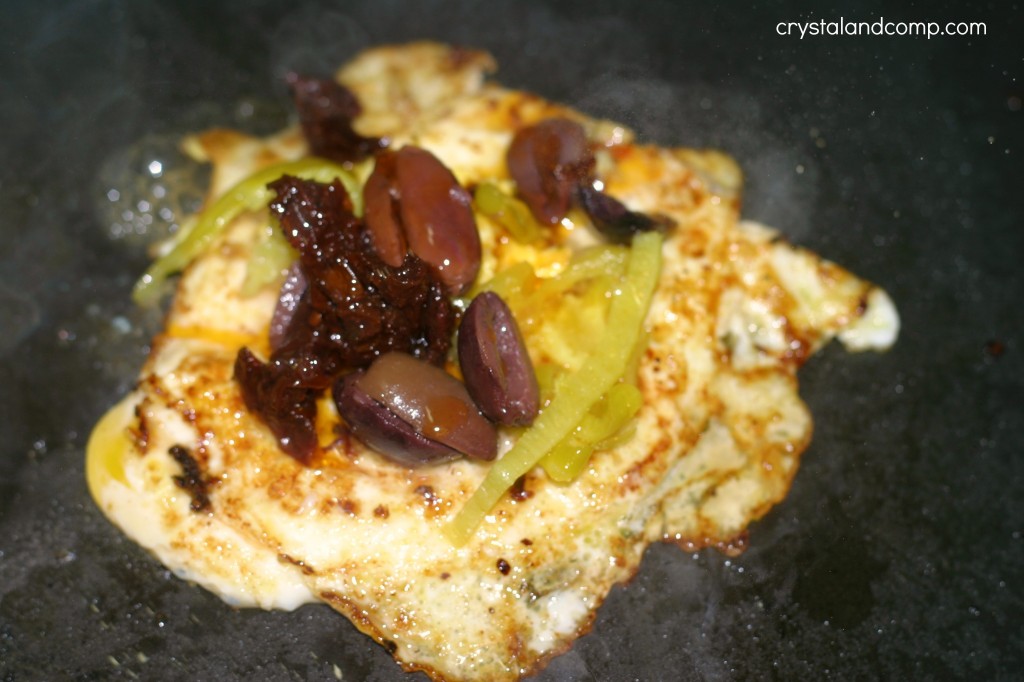 fried egg sandwich using MEZZETTA olives peperocini and sun dried tomatoes