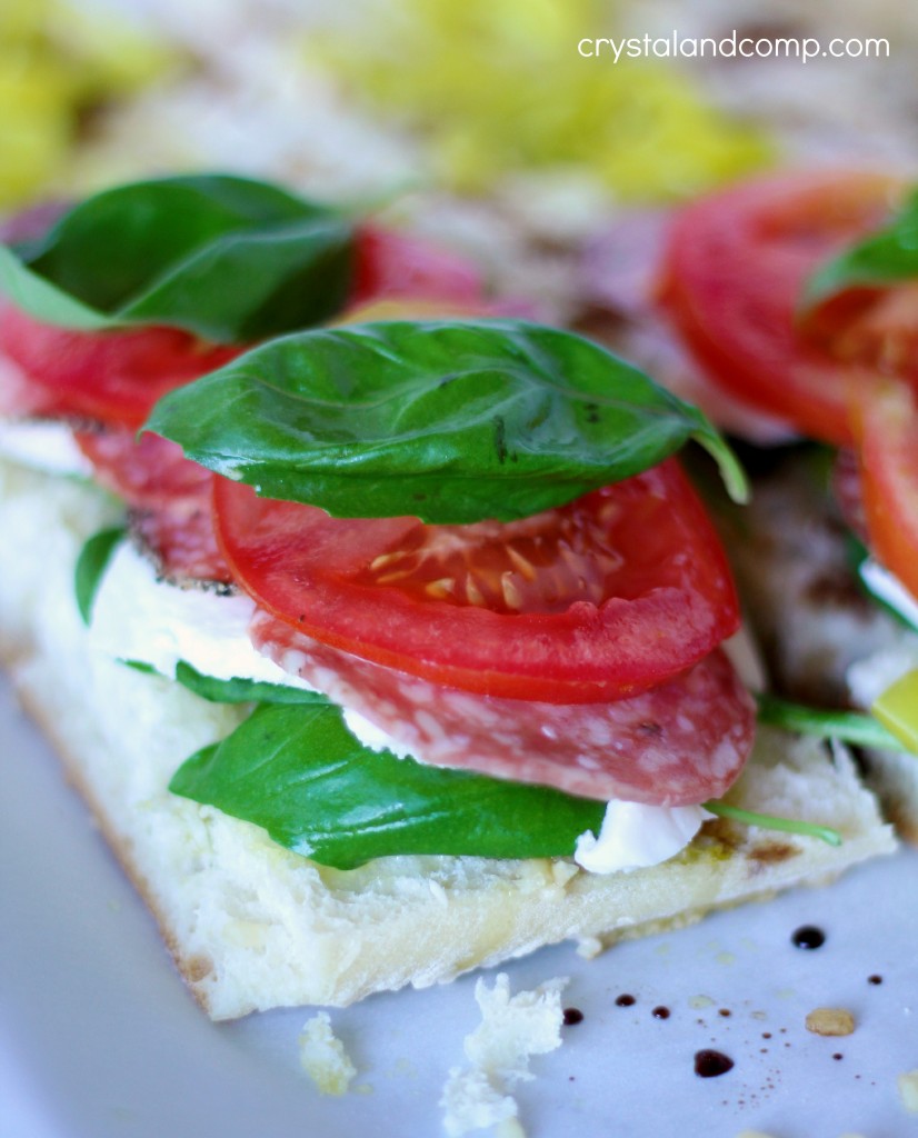 mozzarella salami spinach and basil sandwich