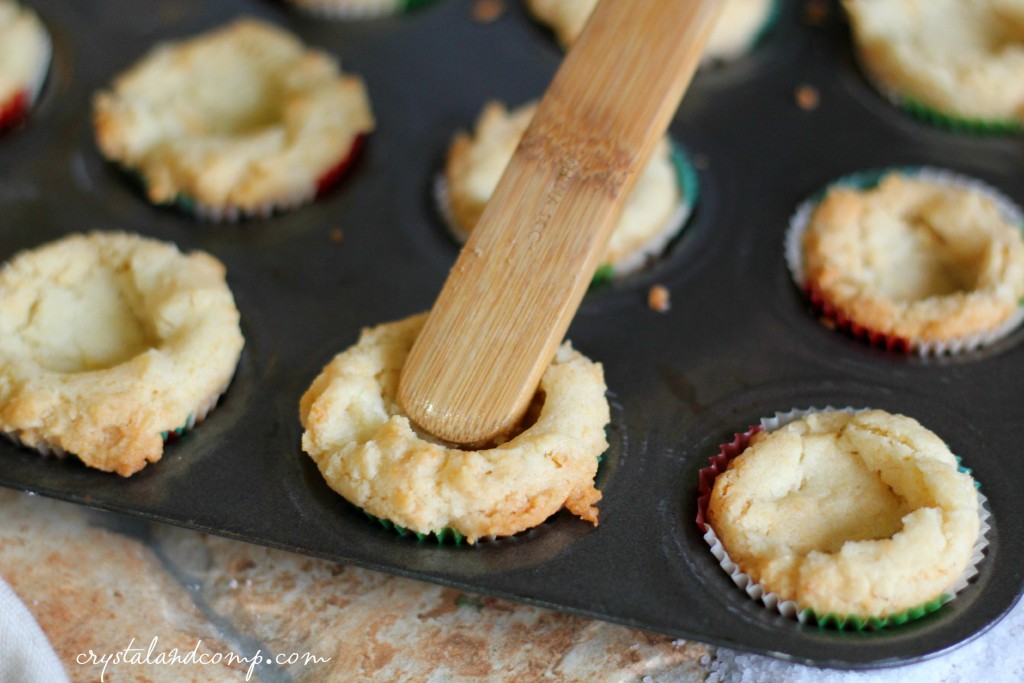 use a wooden spoon handle to make an indention in the cookies