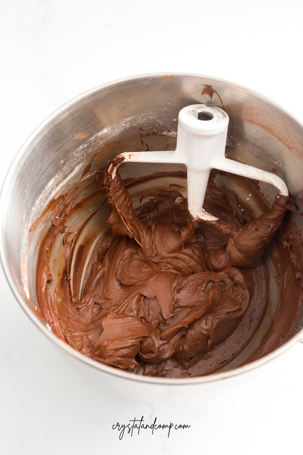 chocolate buttercream icing batter in bowl