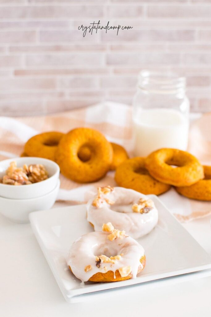 baked pumpkin donuts with walnuts in a bowl