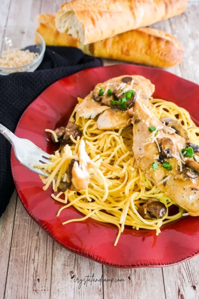 forkful of chicken marsala and spaghetti