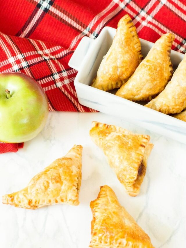apple turnovers on marble with fruit
