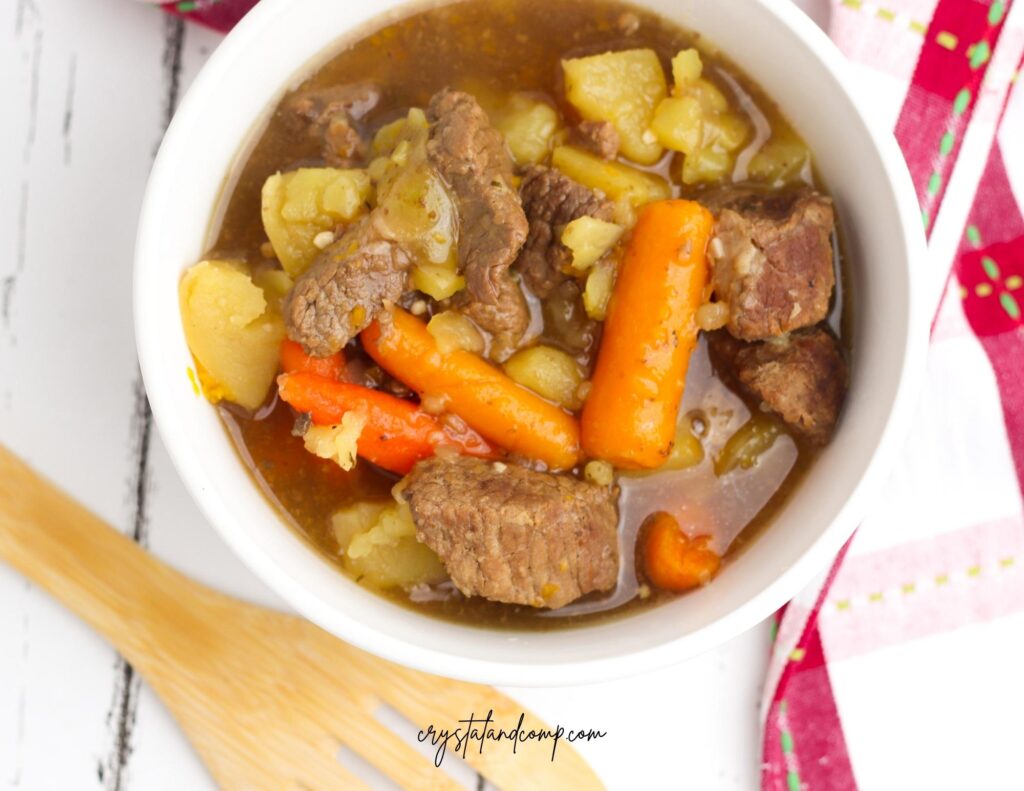 instant pot beef stew with spoon and towel