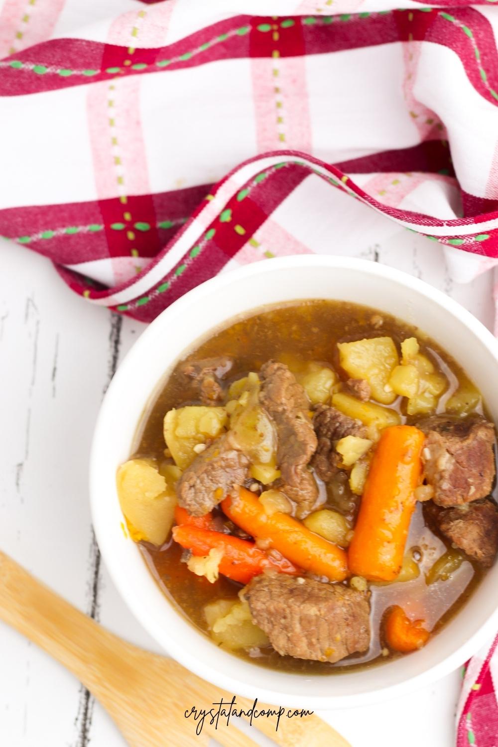 instant pot beef stew with wooden spoon