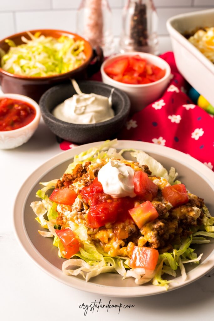 taco bake recipe with shredded lettuce and tomatoes