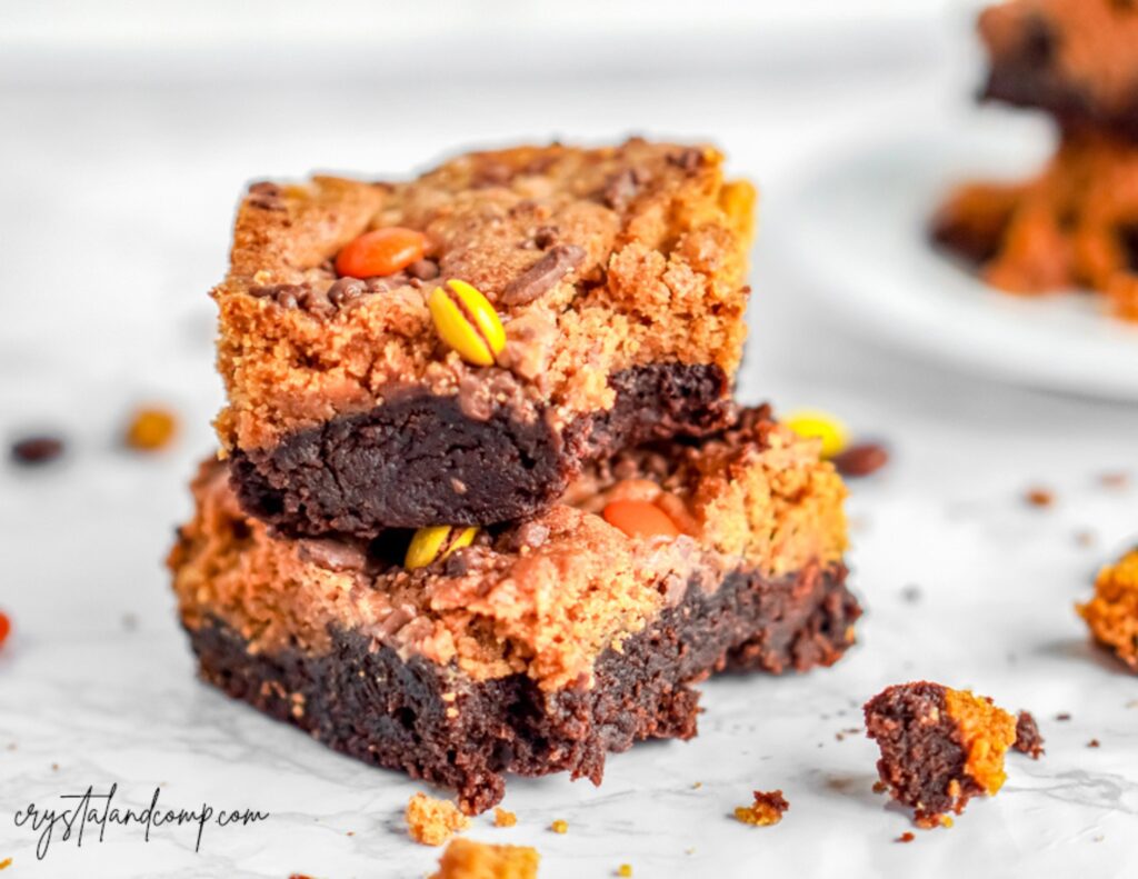 pumpkin peanut butter brownies stacked with crumbs