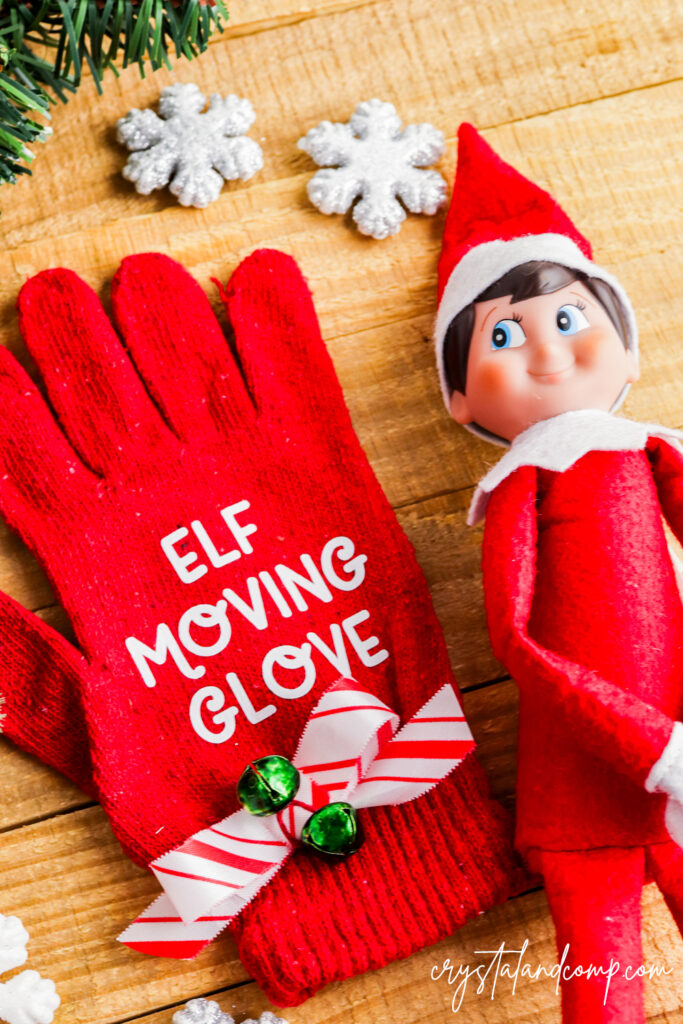 elf moving glove with snowflakes and ribbon